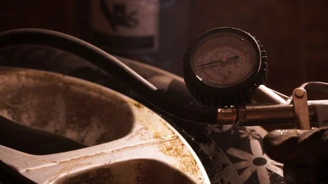 Pump the wheels to the tire, the device for pumping the wheel Stock Footage 114630885