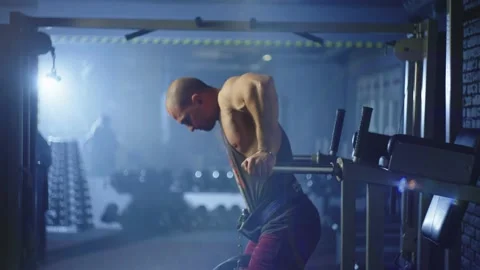 A pumped-up athlete performs an exercise with his own weight. Stock Footage 237172375