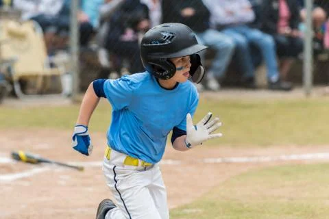 Pumping the arms for more speed on basepath. Stock Photos