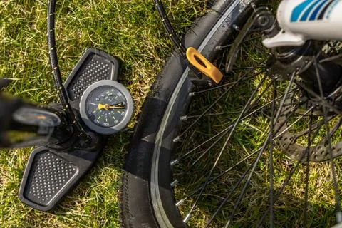 Pumping up a bicycle with a pump, flat tire, repairing a flat inner tube in.. Stock Photos