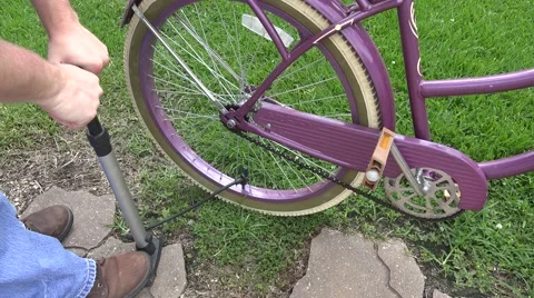 Pumping up bicycle tire in 4K Stock Footage 51502812