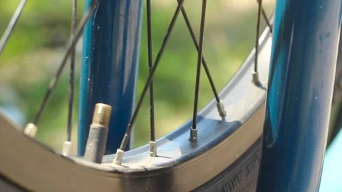 Pumping a bicycle wheel. Stock Footage 134121625