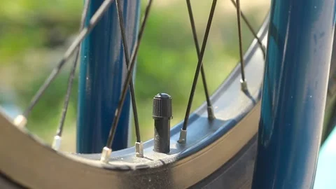 Pumping a bicycle wheel. Video stock 134121646