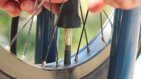 Pumping a bicycle wheel. Stock Footage 134122002