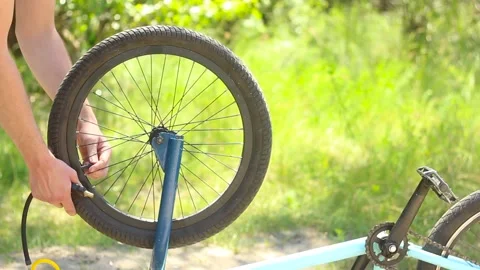 Pumping a bicycle wheel. Stock Footage 134122095