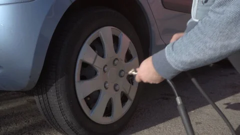 Pumping the car wheel. Stock Footage 97413066