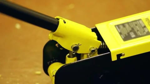 Pumping hydraulic jack using handle Stock Footage 323606022