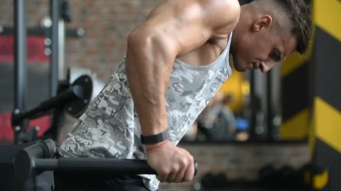 Pumping up muscles push-ups on uneven bars Stock-Footage 105636982