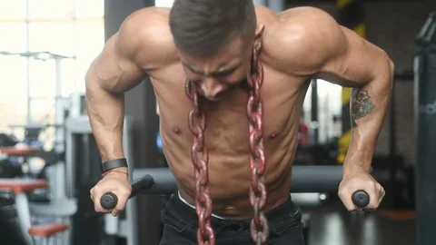 Pumping up muscles push-ups on uneven bars Stock Footage 105637286