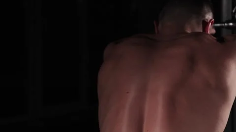 Pumping muscles on a simulator, bodybuilder athlete pumping muscles Stock Footage 62759001