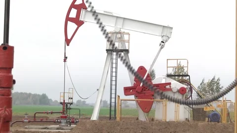 The pumping unit as the oil pump installed on a well Video stock 103625273