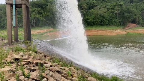 Pumping water flowing from large water pipe into dam water storage, Thailand Video stock 280044799