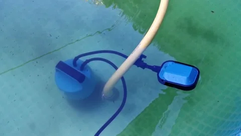 Pumping water out of the pool using drai... | Stock Video | Pond5