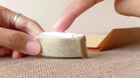 Pumping a white glue on a sponge Stock Footage 146246294