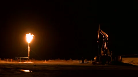 Pumpjack and gas flare Stock Footage 44616316