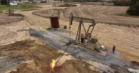 Pumpjack Moves up and Down Fracking for Oil in the Midwest USA Stock Footage 219372700