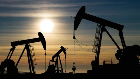 Pumpjack Silhouette: Time Lapse at Sunset with Colorful Clouds Stock Footage 150727250