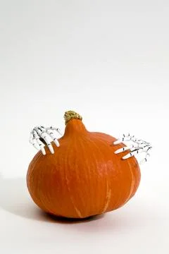 Pumpkin and hands Stock Photos