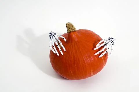 Pumpkin and hands Stock Photos