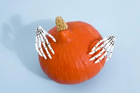 Pumpkin and hands Stock Photos
