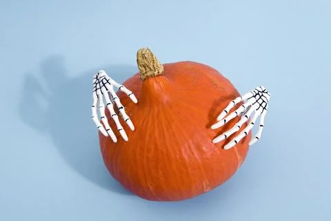 Pumpkin and hands Stock Photos