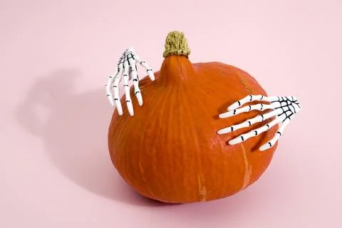 Pumpkin and hands Stock Photos