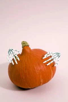 Pumpkin and hands Stock Photos