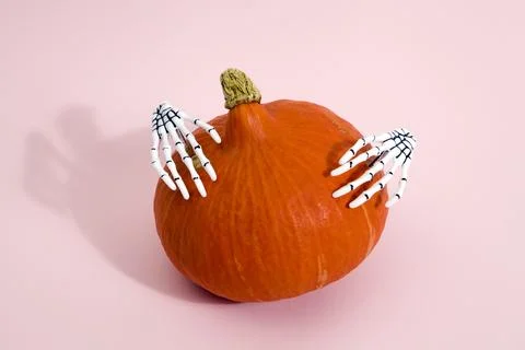 Pumpkin and hands Stock Photos