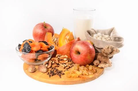 Pumpkin and ingredients for pumpkin casserole with nuts and dried fruits on a Stock Photos