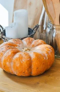 Pumpkin and kitchen ware on a table. Close up. Stock Photos