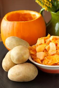 Pumpkin and potatoes Stock Photos
