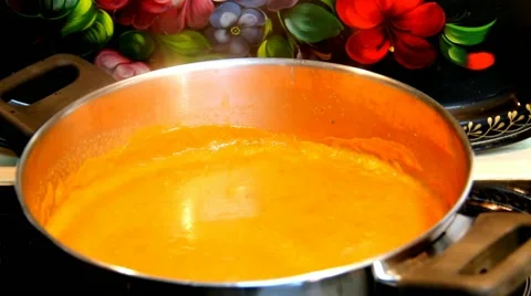 Pumpkin based soup  being cooked in a pot on the stove Vídeo Stock 49205383