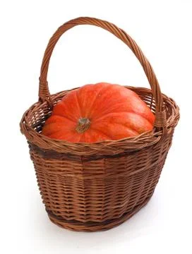 Pumpkin in the basket Stock Photos