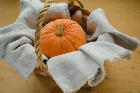 Pumpkin in the basket Stock Photos