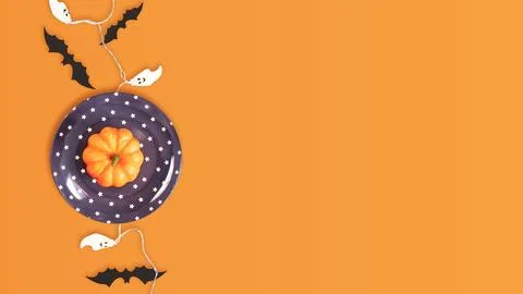 Pumpkin, Bats, and Ghosts on Orange Backdrop with Copy Space, Stock Photos