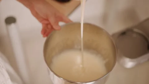 Pumpkin batter being thoroughly mixed. Vigorous stirring creates smooth pumpkin Stock Footage 348301333