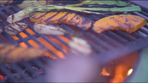 Pumpkin being cooked on barbecue grill Video stock 76101644