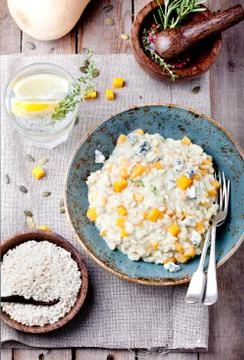 Pumpkin, blue cheese risotto in a ceramic plate Stock Photos