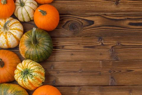 Pumpkin border over rustic wood Fotos Stock