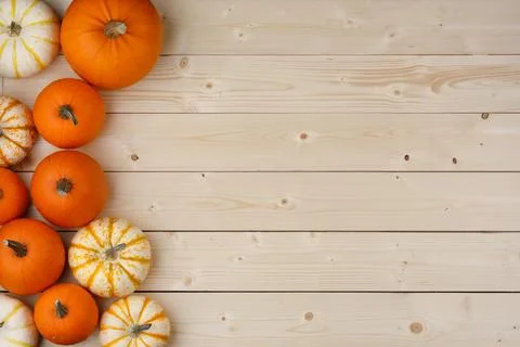 Pumpkin border over rustic wood Fotos Stock