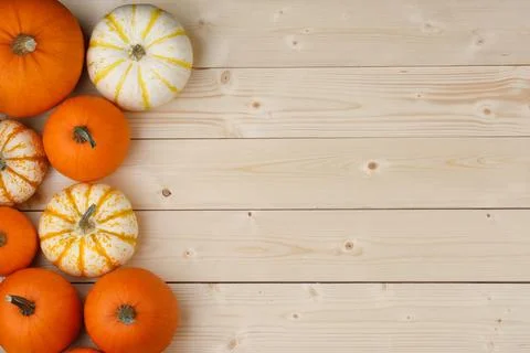 Pumpkin border over rustic wood Fotos Stock