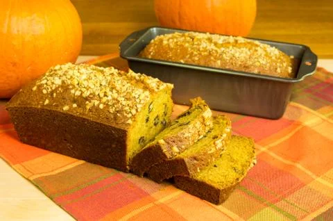 Pumpkin bread loaf sliced with pumpkins Stock Photos