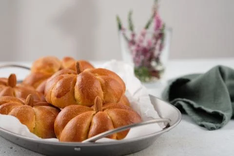Pumpkin buns bread on grey background. Halloween Food Concept. Autumn concept. Stock Photos