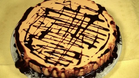 Pumpkin cake covered with chocolate icing Stock Footage 71357912