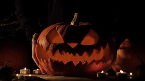 Pumpkin Carved For Jack O'Lantern By Man In Kitchen, 4K. Family Pumpkin Stock Footage 272459535