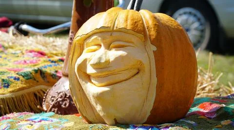 Pumpkin carving in the shape of a human head. Halloween pumpkin. Stock Photos