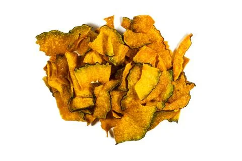 Pumpkin chips on white background Stock Photos