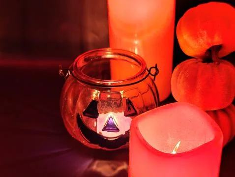 Pumpkin composition with red ominous background, macro photography. Halloween Stock Photos