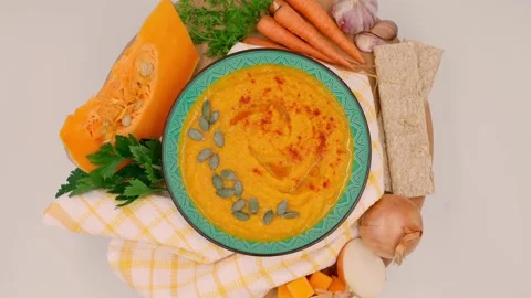 Pumpkin cream soup on white background, vegetables for making soup Stock Footage 162959845