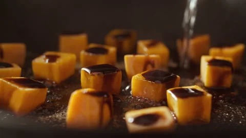 Pumpkin cubes and balsamic vinegar with water poured on Stock Footage 135049929